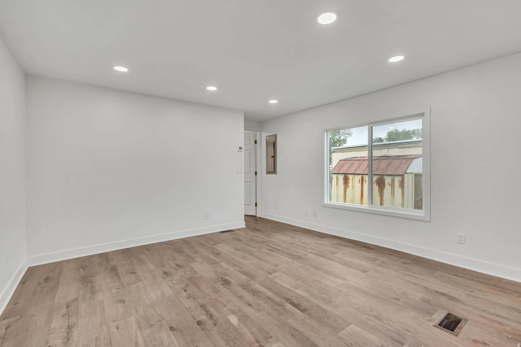 Spare room featuring recessed lighting and light wood-style flooring