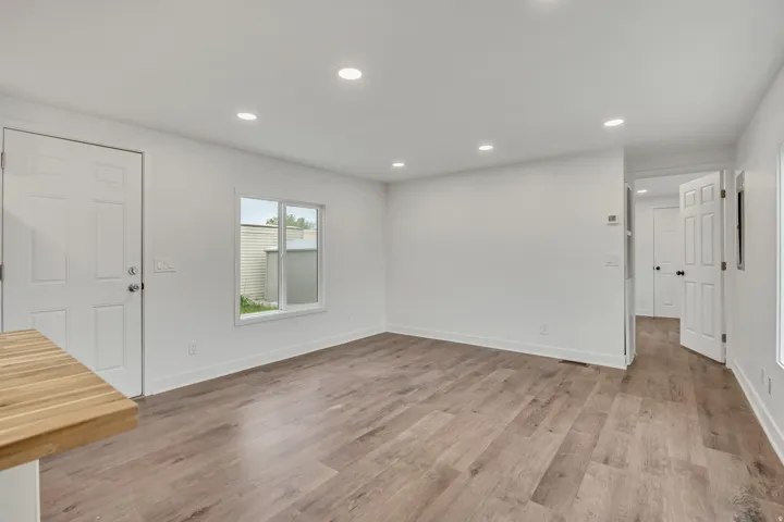 Unfurnished living room with recessed lighting and light wood-type flooring