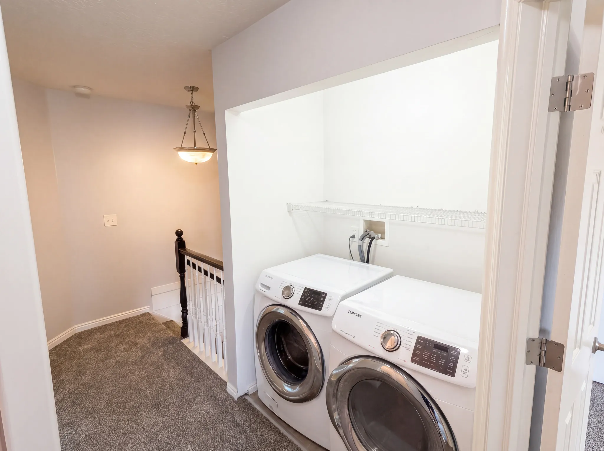 Laundry area featuring carpet and washer and dryer