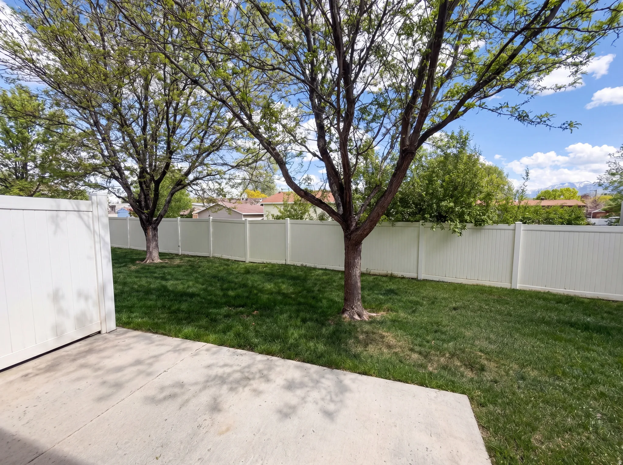 Fenced backyard featuring a patio