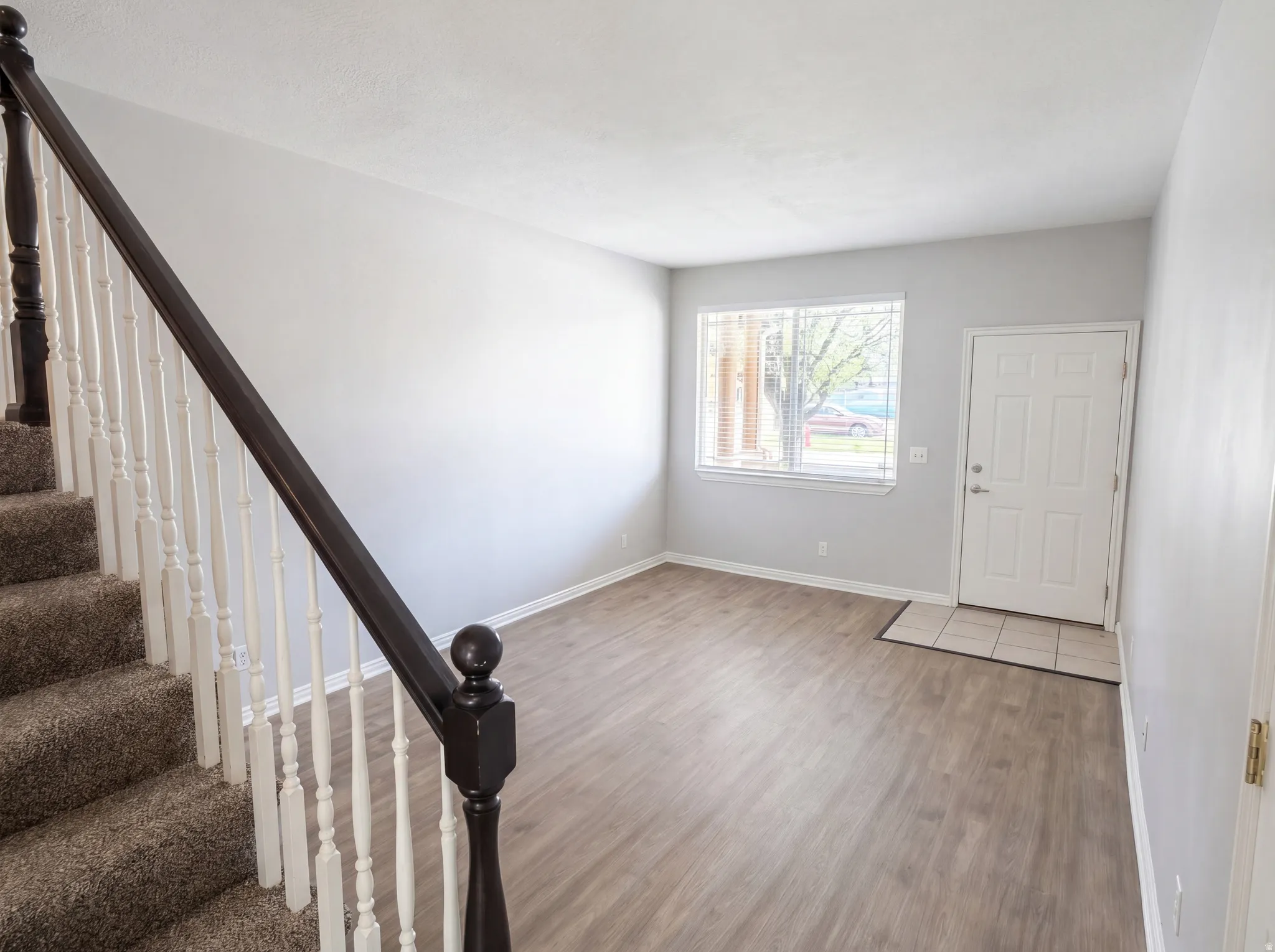 Foyer entrance featuring baseboards and light wood-style flooring