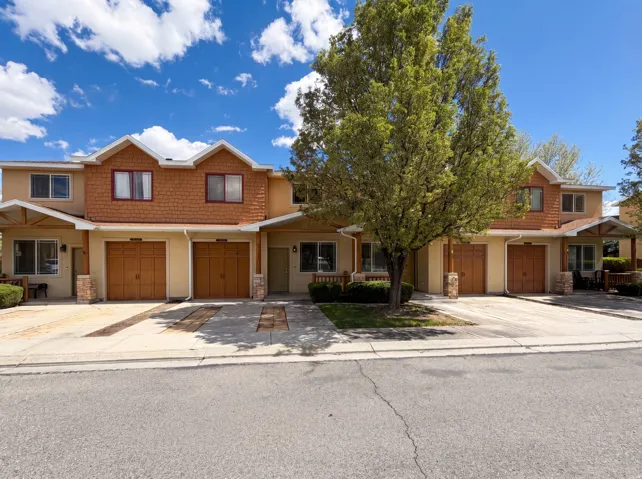 View of front of property featuring driveway and an attached garage