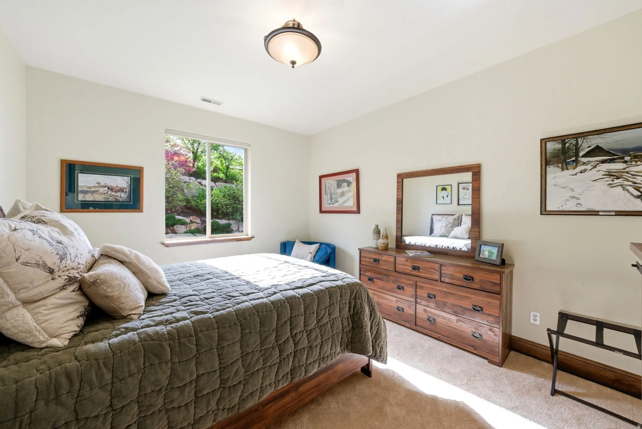 2nd Bedroom featuring light colored carpet and wood baseboards