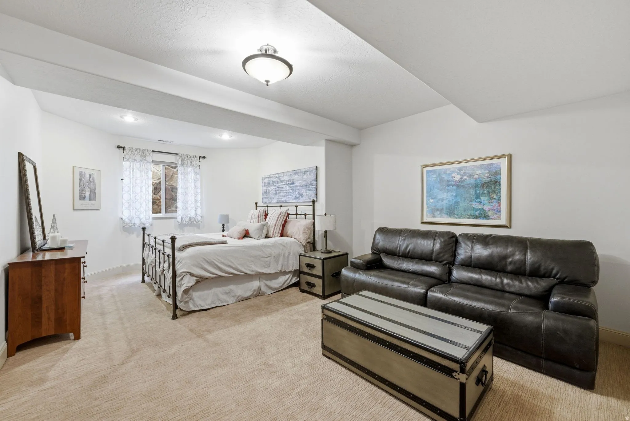 4th bedroom with light carpet with seating area