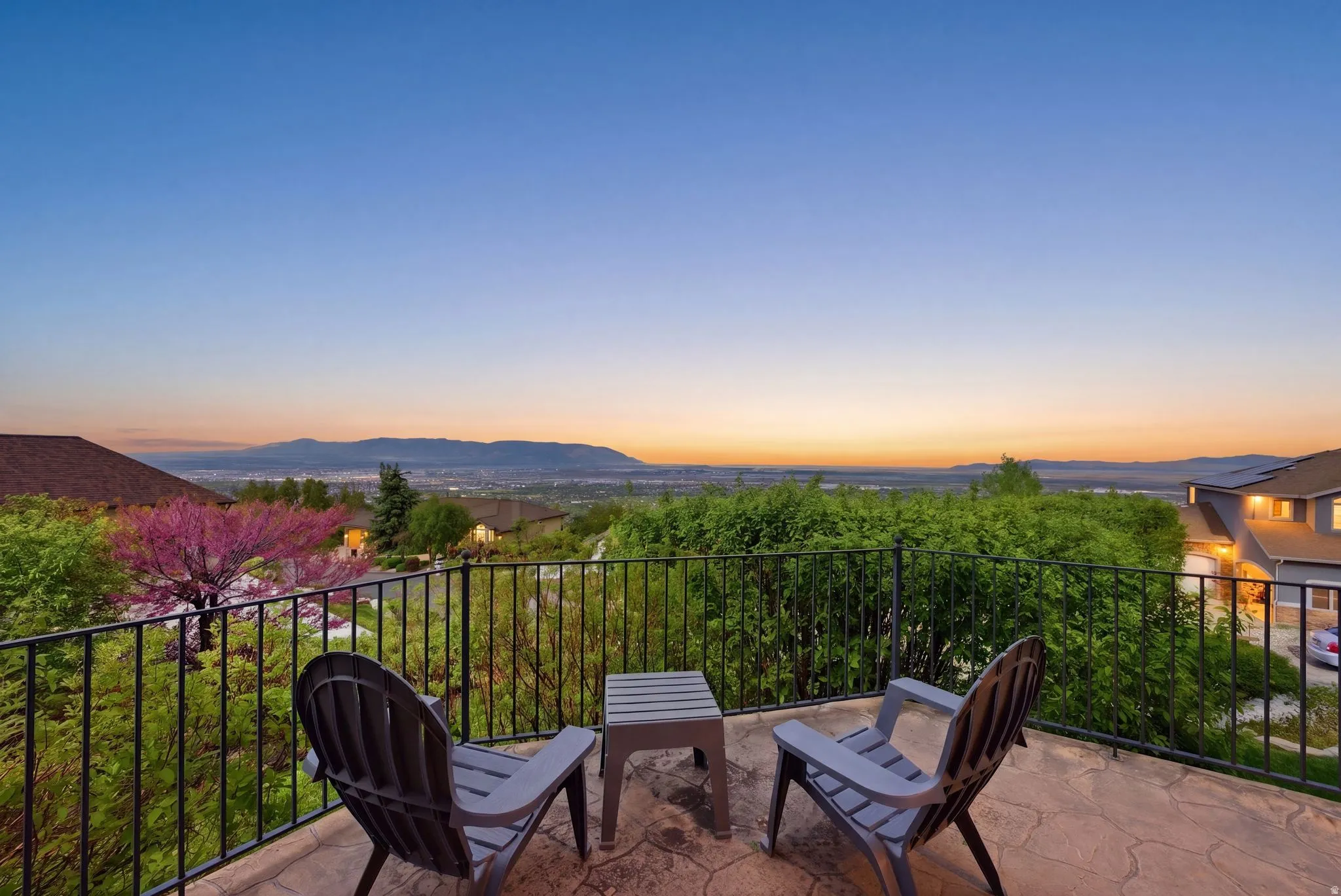 Balcony at dusk featuring a mountain view