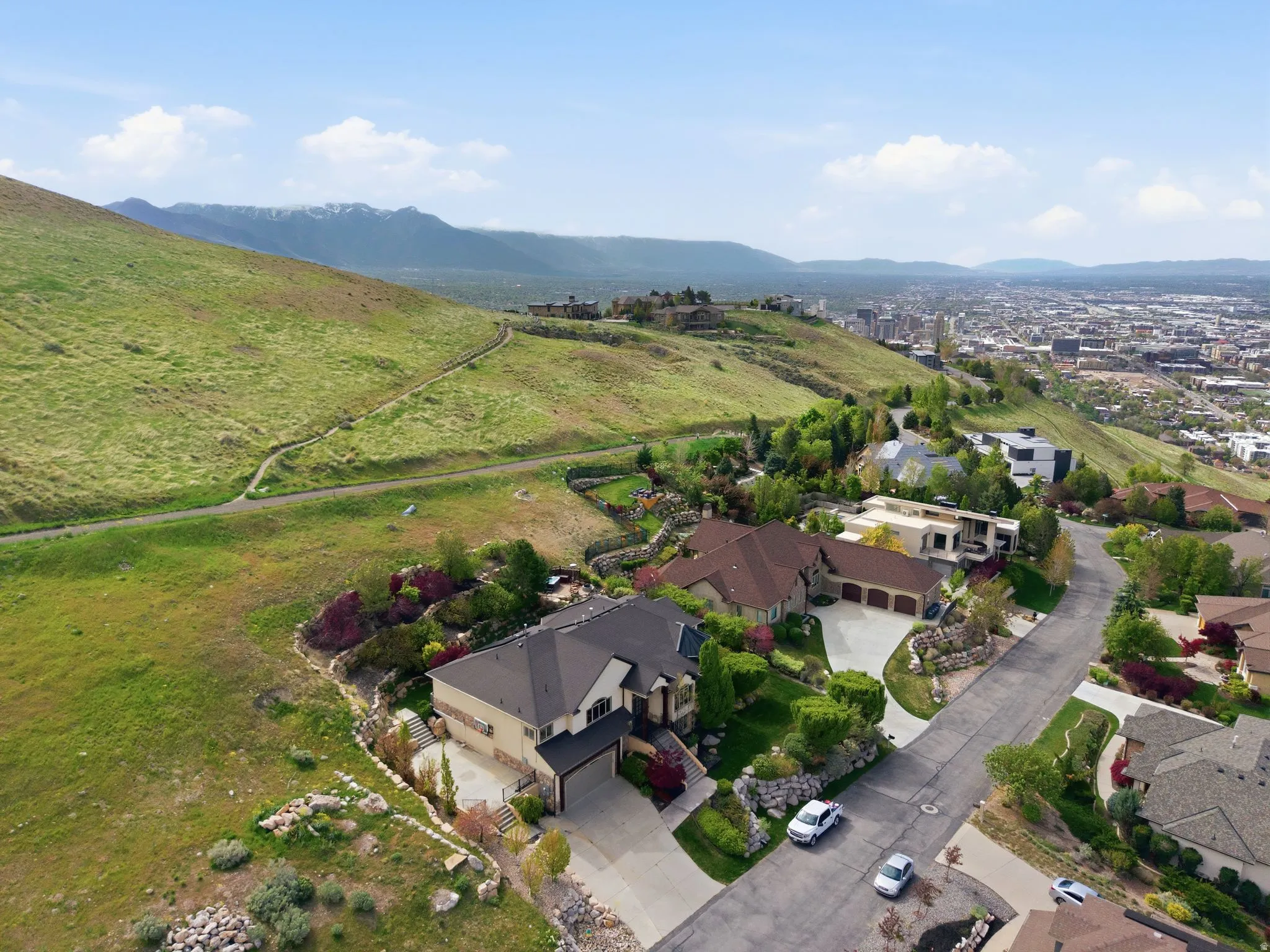 Aerial perspective of suburban area with a mountainous background