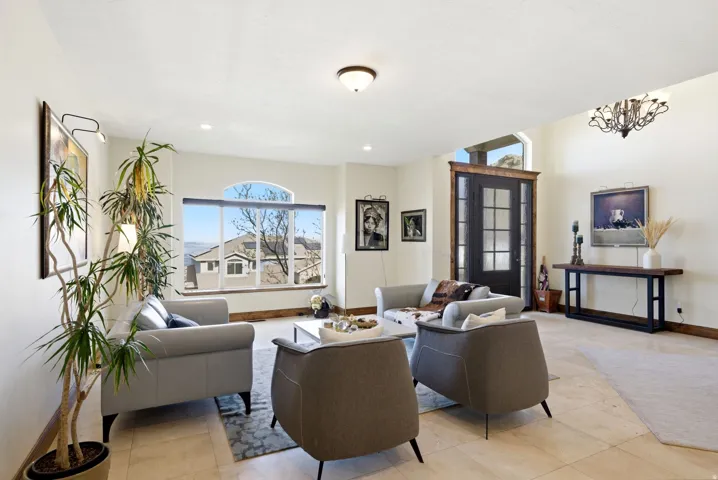 Living room featuring baseboards and light tile patterned flooring
