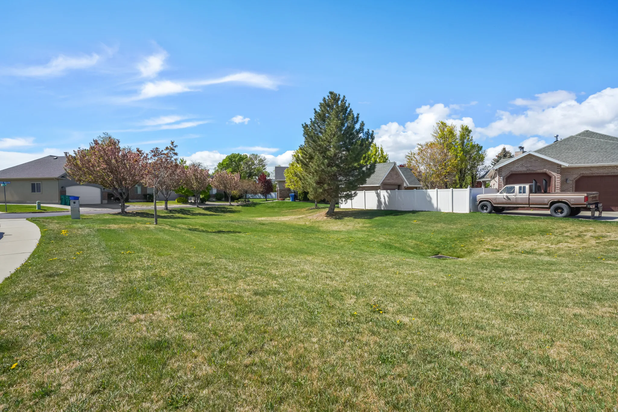 View of yard with a residential view and a garage