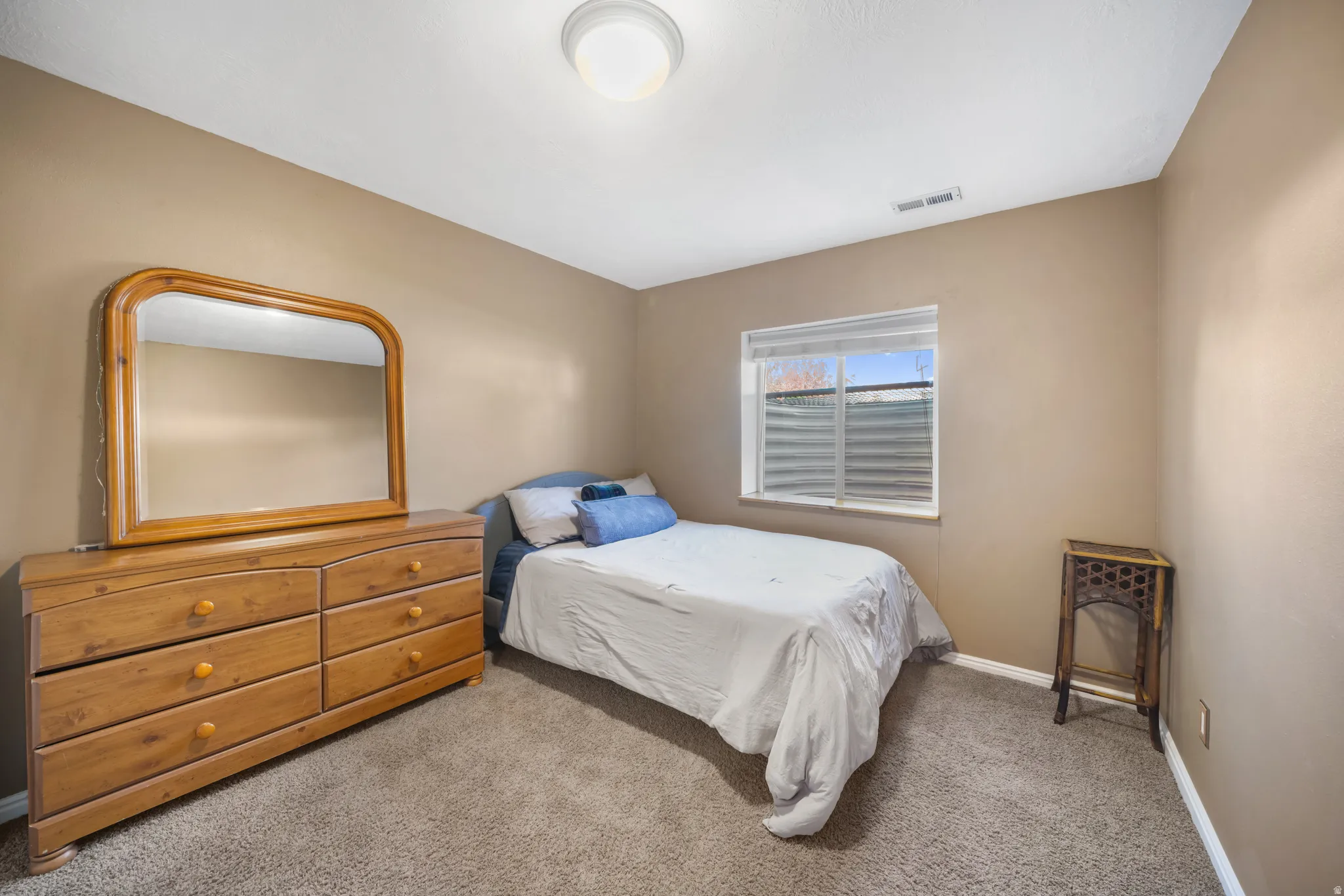 Carpeted bedroom with baseboards