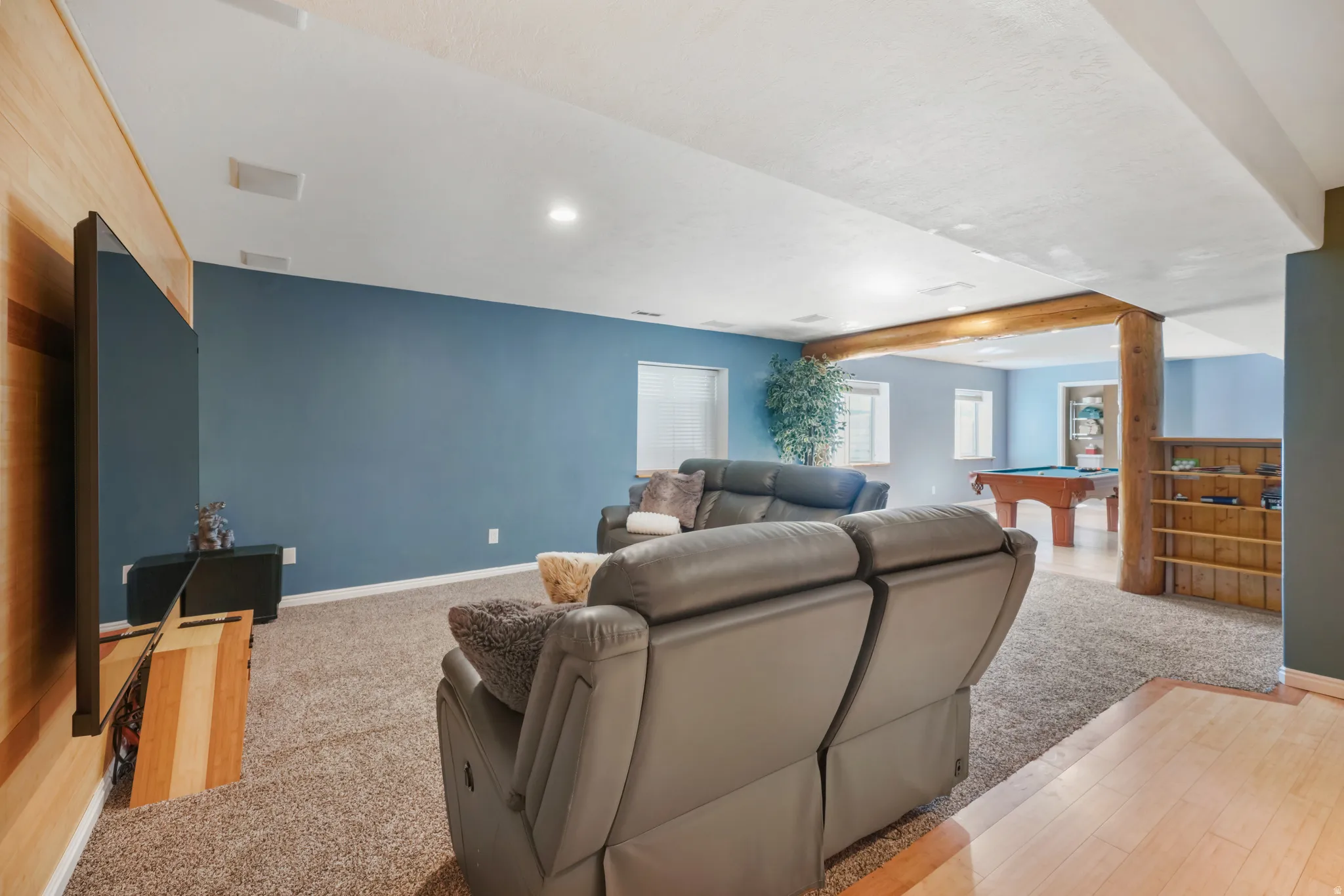 Living room with billiards, recessed lighting, and light carpet