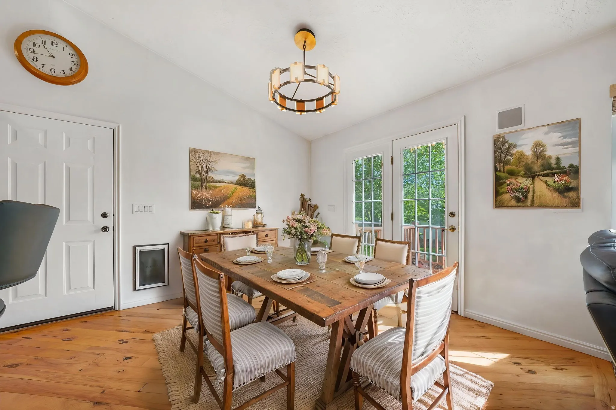 Virtual Image!  Dining space with light wood-style flooring, vaulted ceiling, and suspended lighting