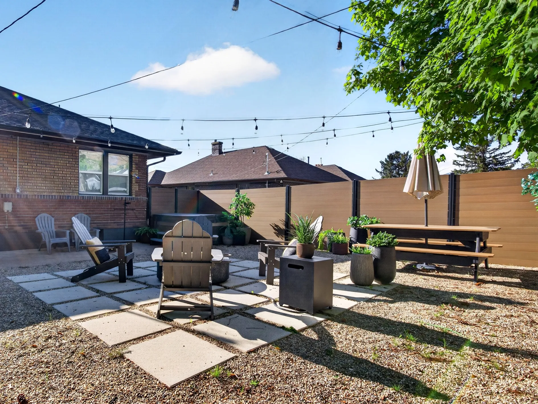 Fenced backyard with a patio