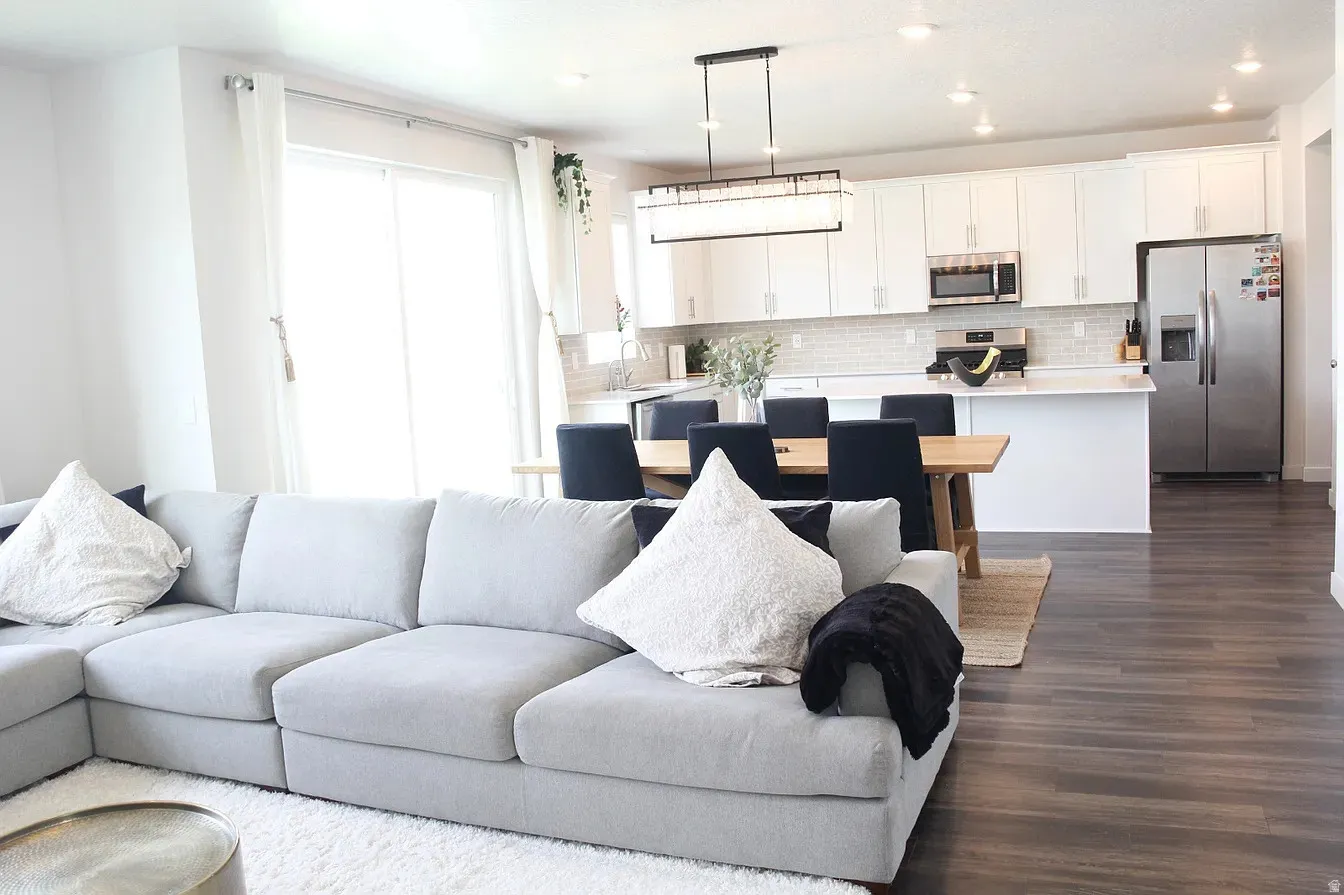Living area featuring dark wood-style floors and recessed lighting