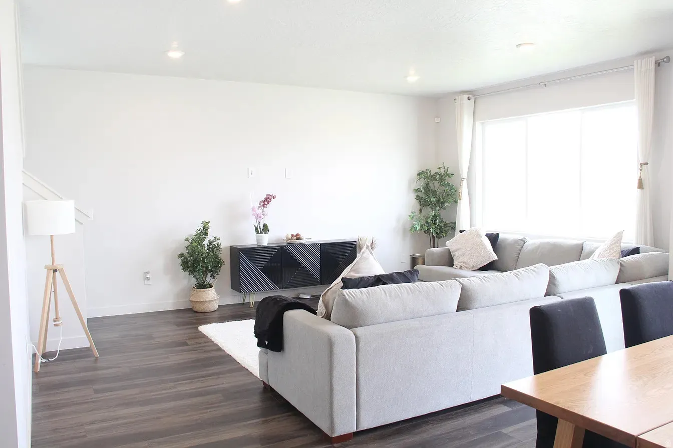 Living room featuring dark wood-style floors and recessed lighting