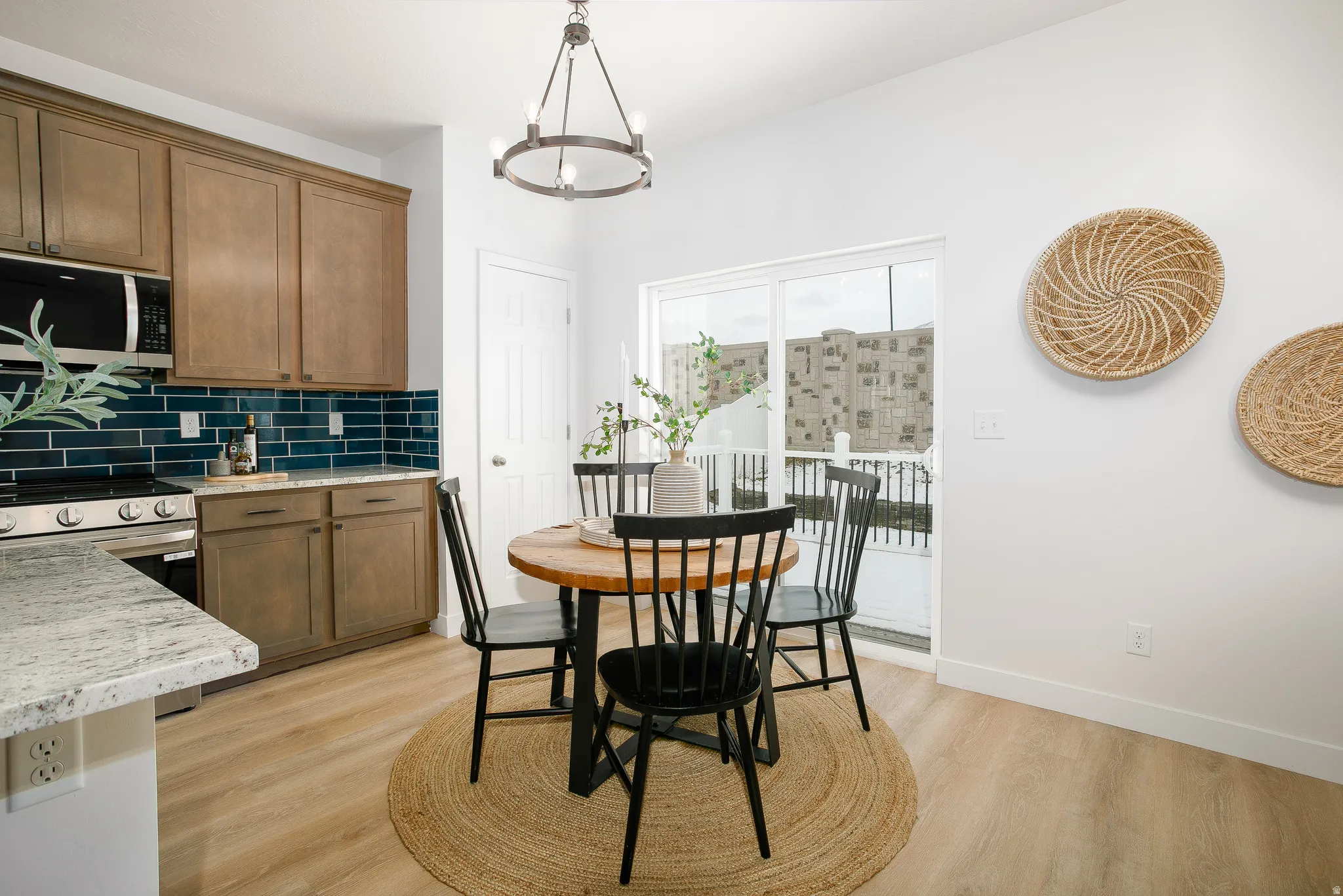 Dining space featuring light wood-type flooring and hanging lights