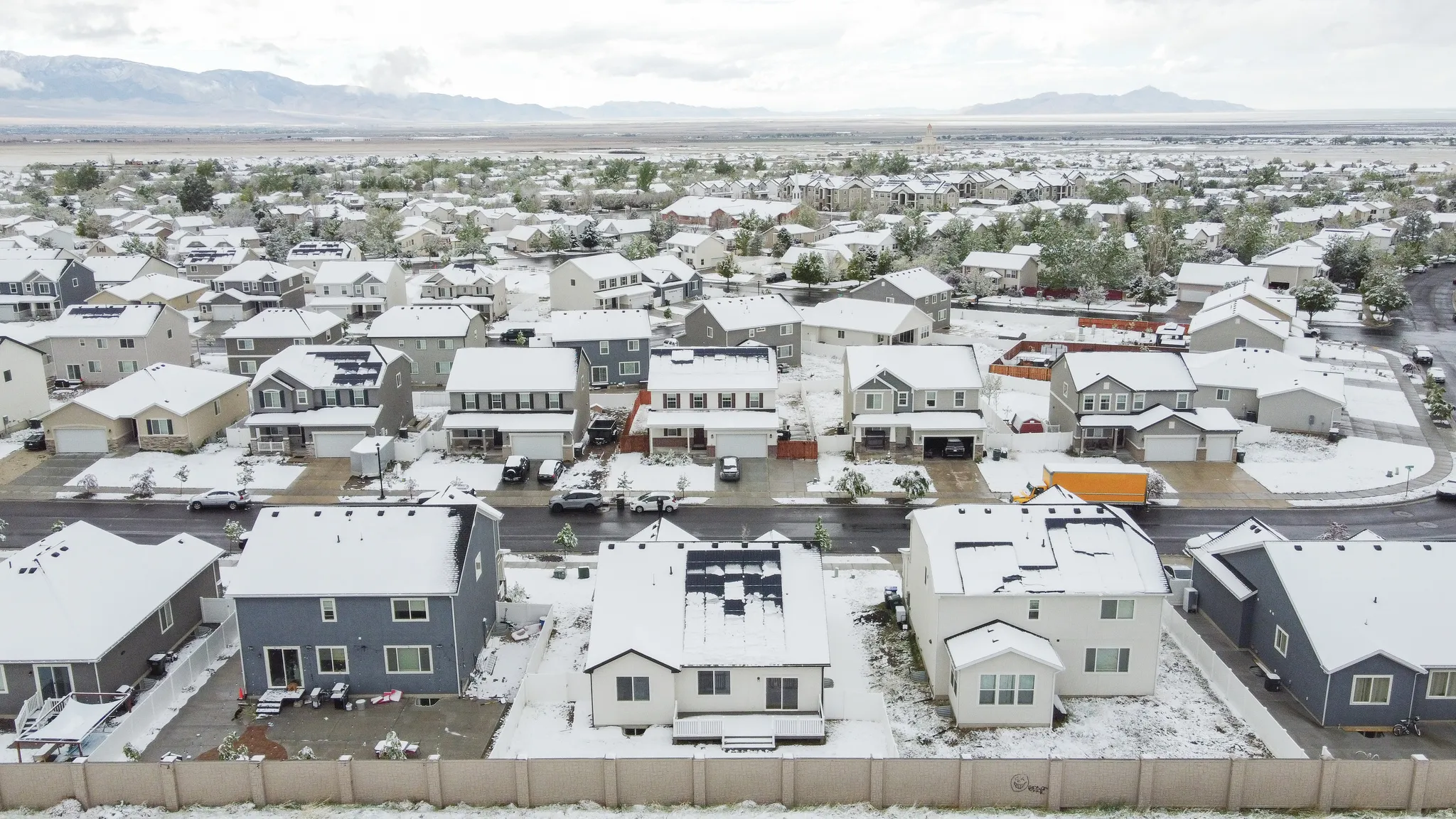Aerial view of residential area featuring mountains