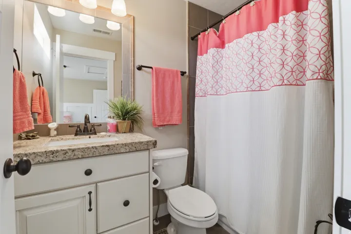 Bathroom featuring vanity and a shower with shower curtain