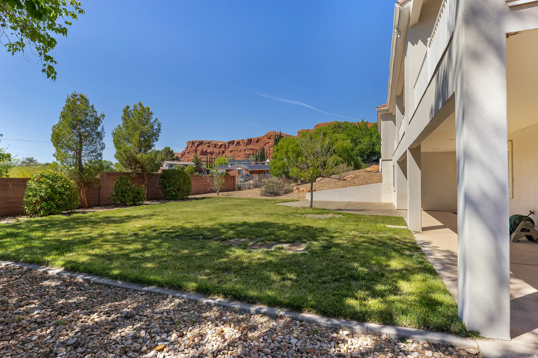 Fenced backyard featuring a mountain view