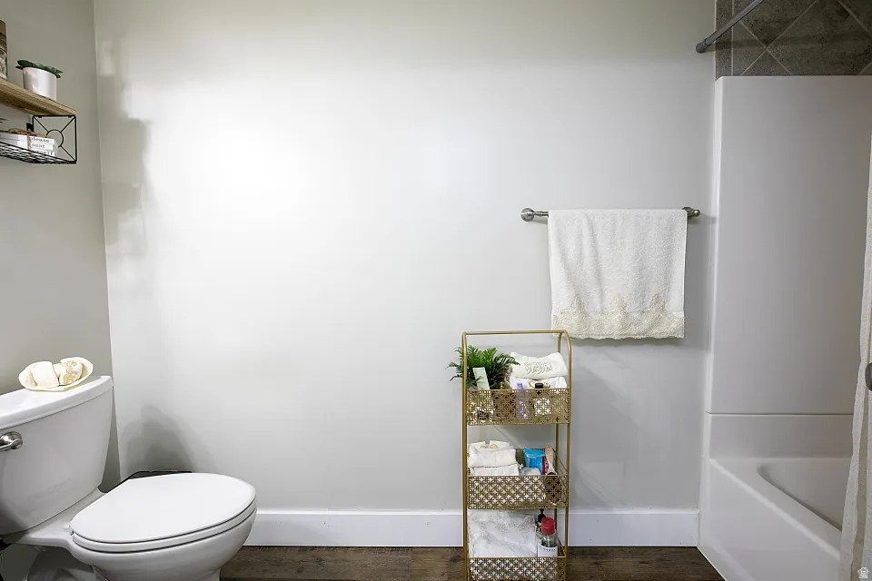 Basement bathroom with full tub/shower.