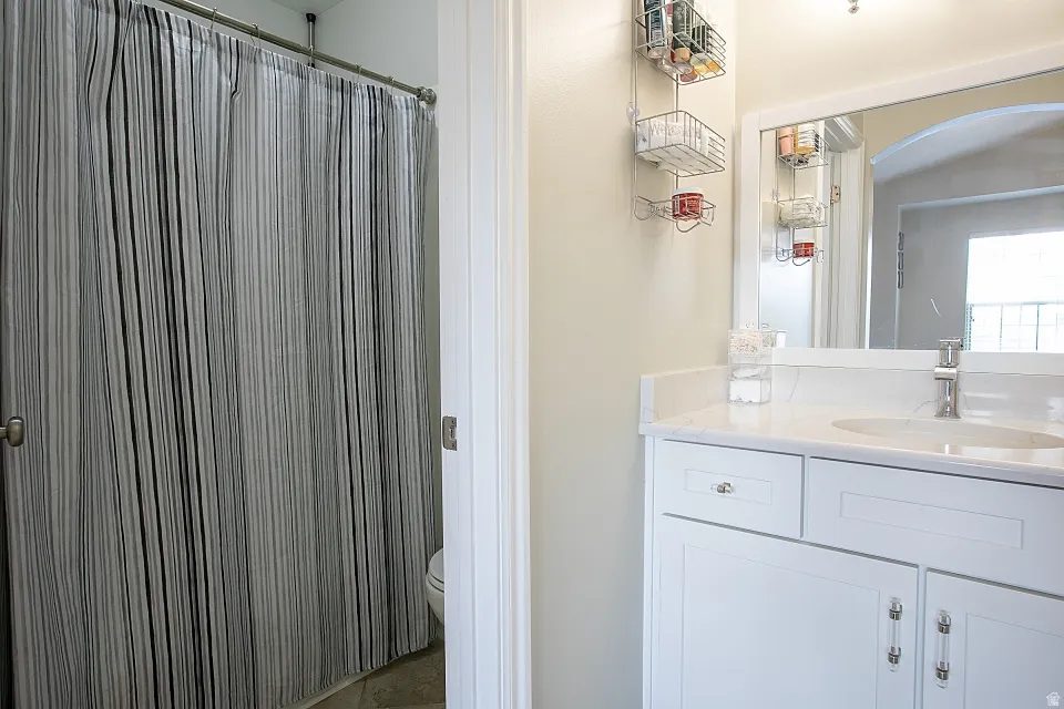 Full bath with vanity and a tub/shower.