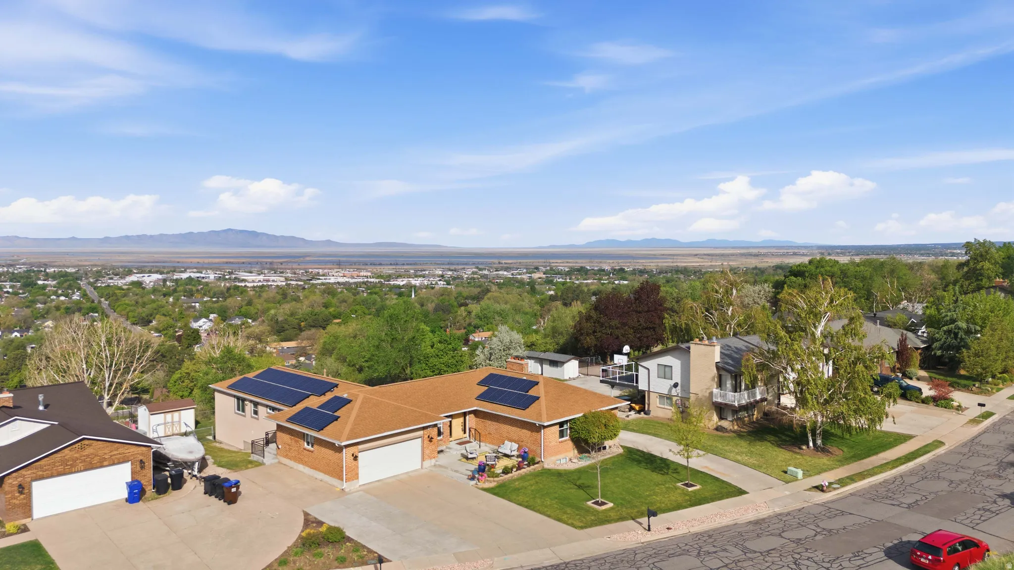 Views for Days!!  Aerial perspective of suburban area featuring a mountainous background