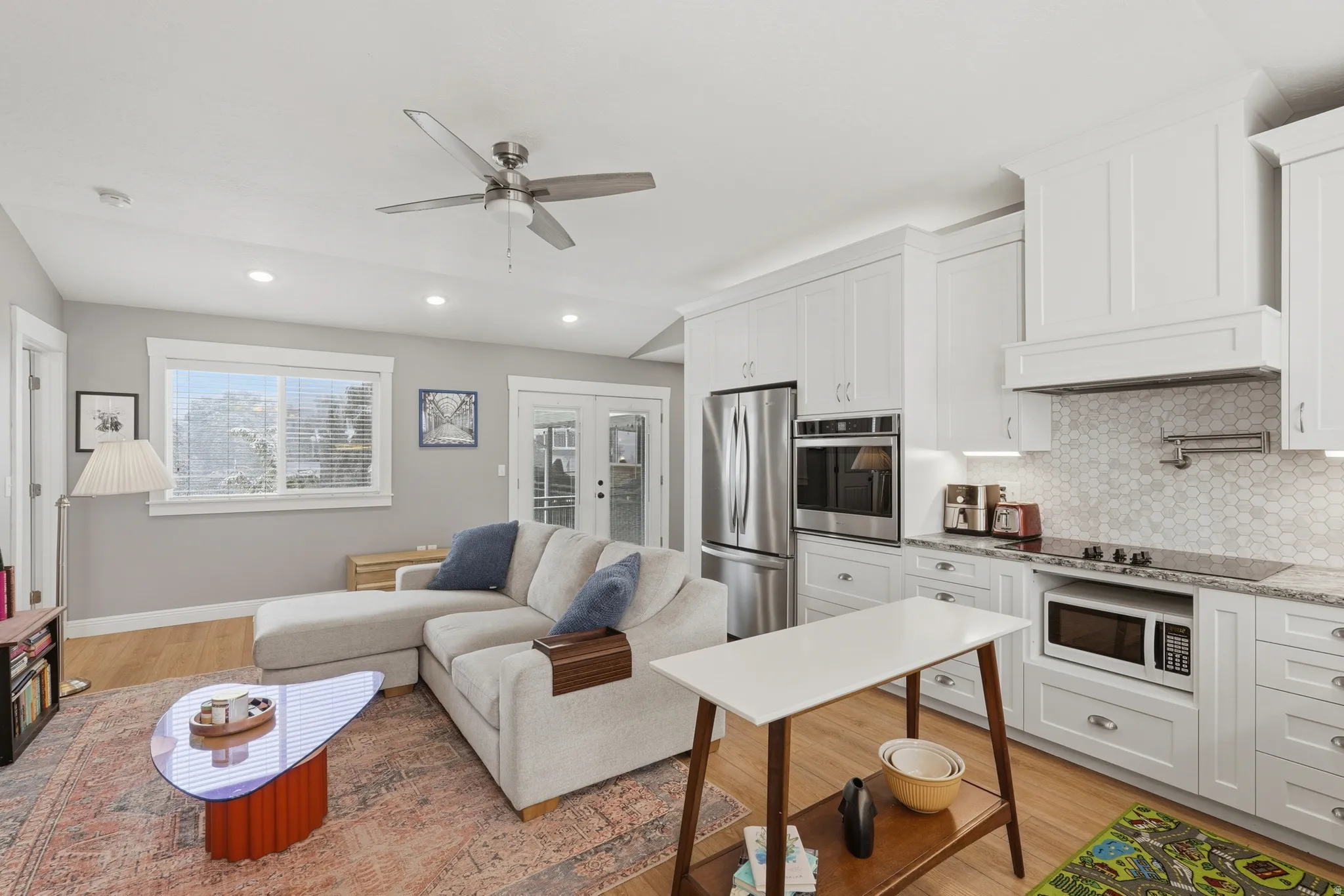 ADU Living room with french doors, light wood-style floors, a ceiling fan, and recessed lighting