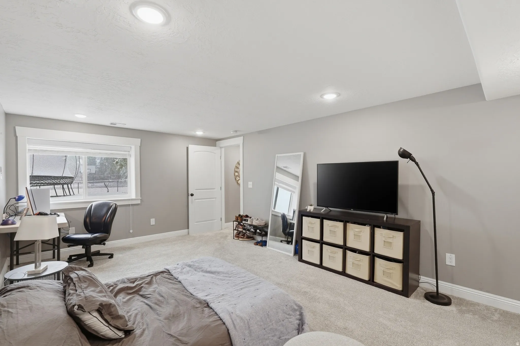 ADU lower level Bedroom with carpet flooring, recessed lighting, and an office area
