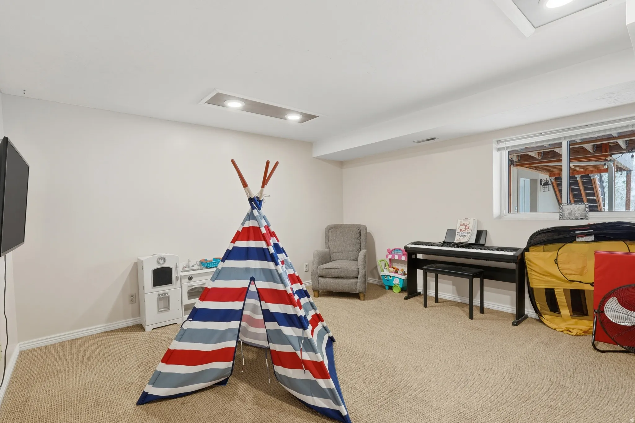 lower level large bedroom currently used as a play room