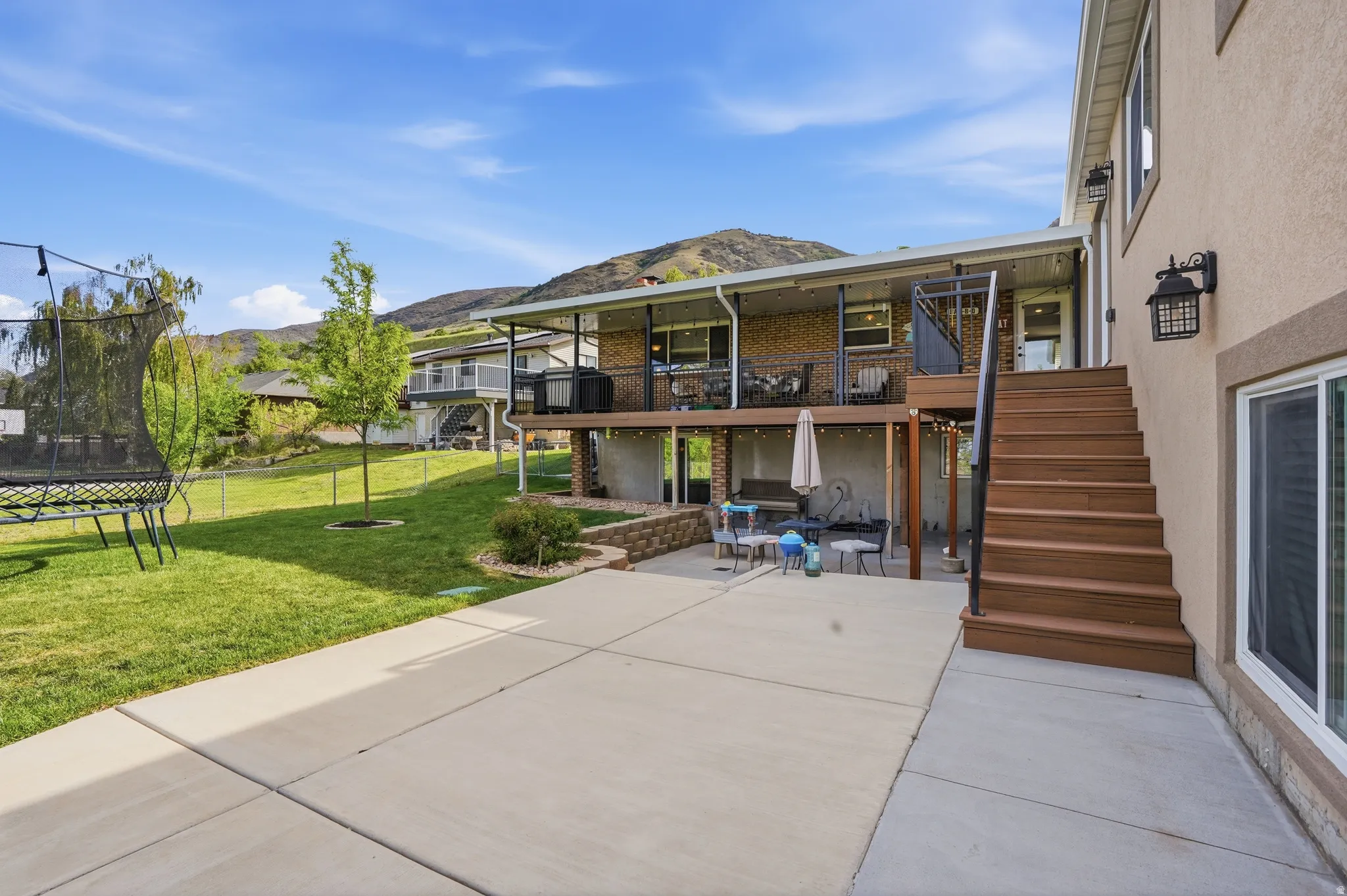 Deep deck with a large patio.  Perfect for dining out and parties