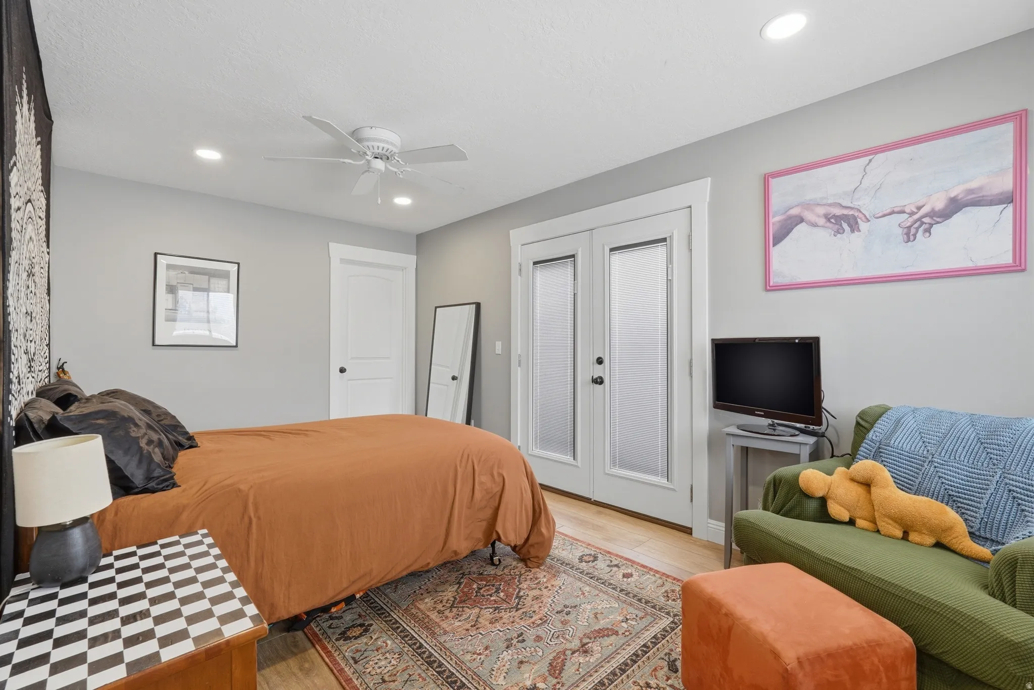 ADU Bedroom featuring light wood-style flooring, ceiling fan, recessed lighting, french doors, and access to exterior