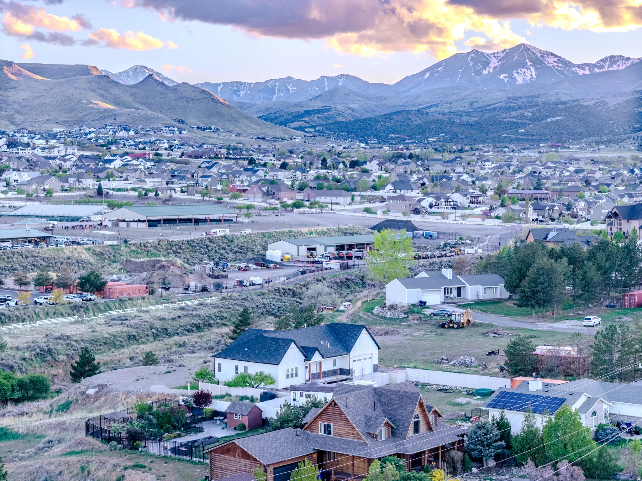 Aerial perspective of suburban area featuring a mountain backdrop
