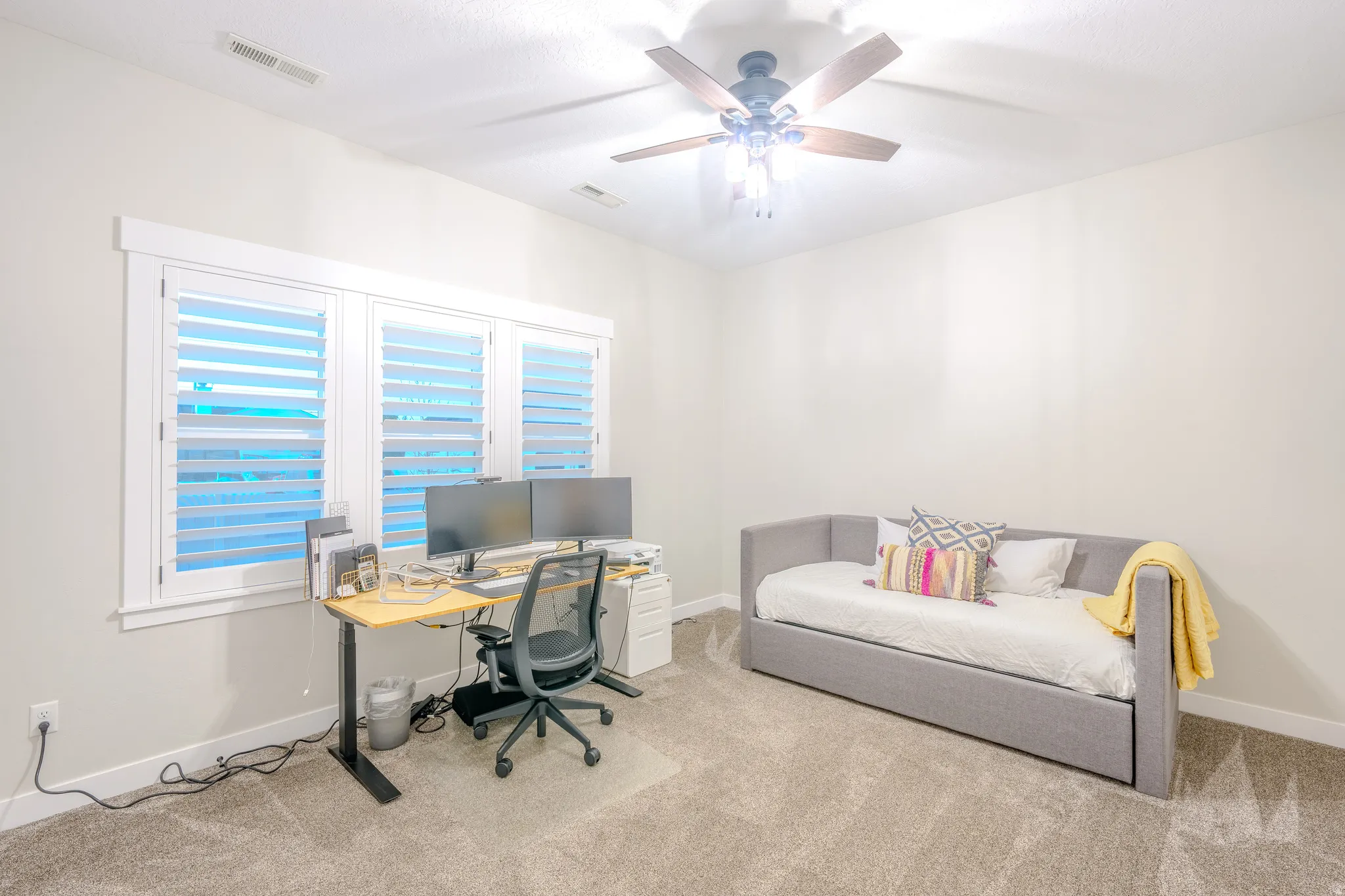Office featuring a ceiling fan and carpet floors