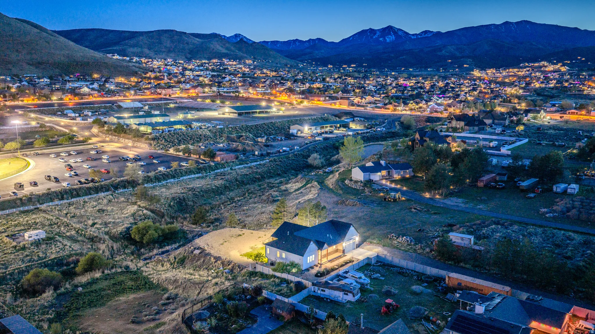 Aerial view of property and surrounding area with mountains