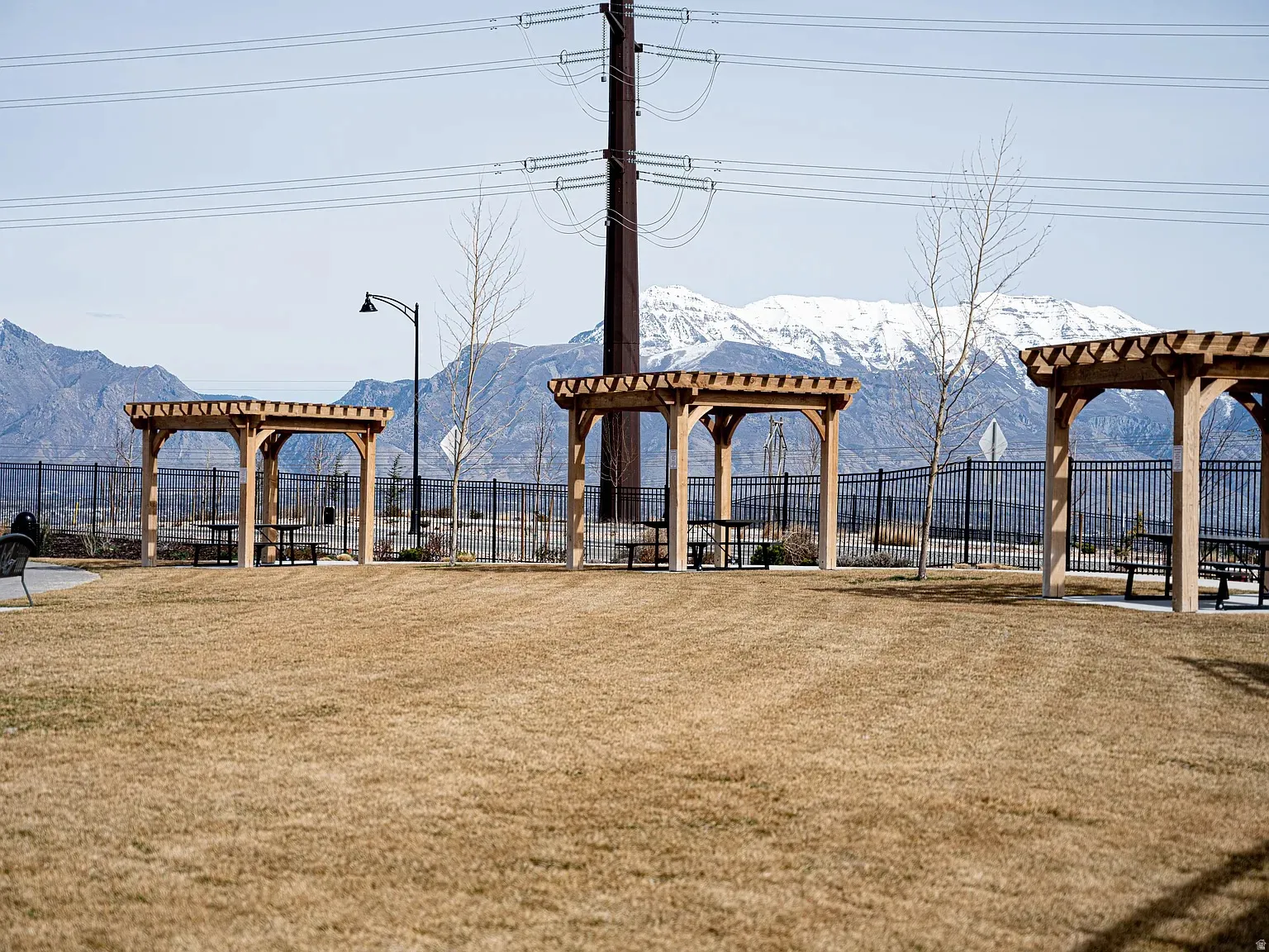 Surrounding community with a pergola, a mountain view, and a patio