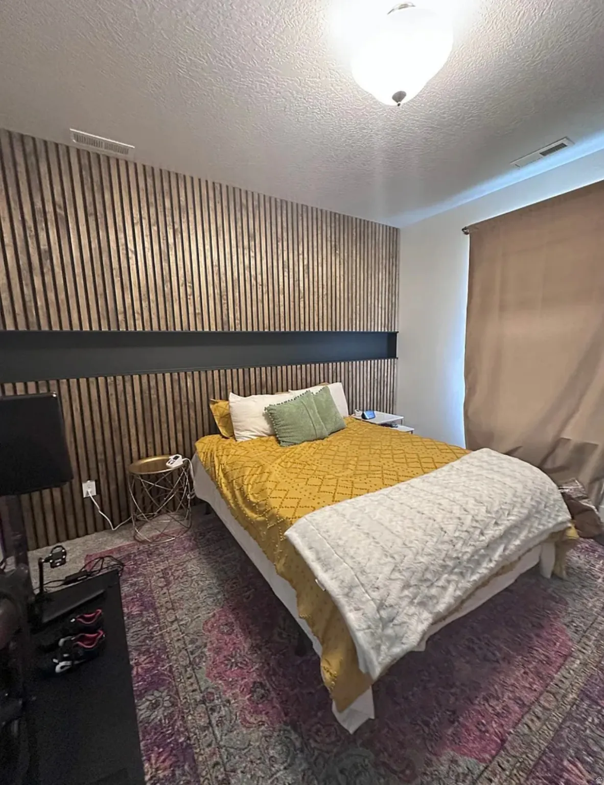 Bedroom featuring a textured ceiling