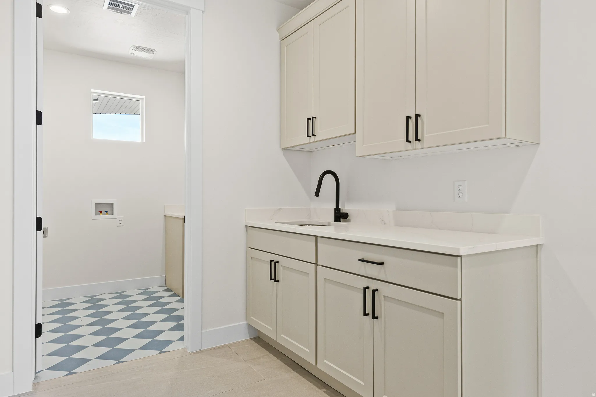 Bar area featuring baseboards and white cabinets