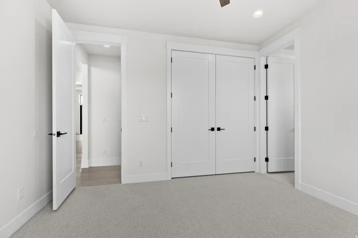 Unfurnished bedroom with light colored carpet, recessed lighting, ceiling fan, and a closet