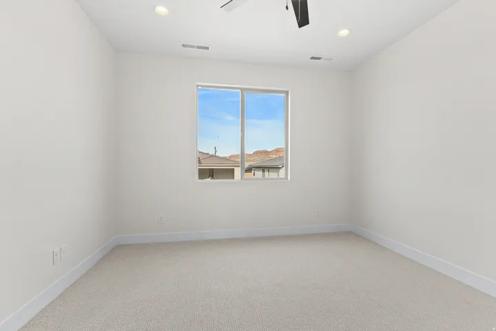 Empty room featuring light carpet, recessed lighting, and a ceiling fan