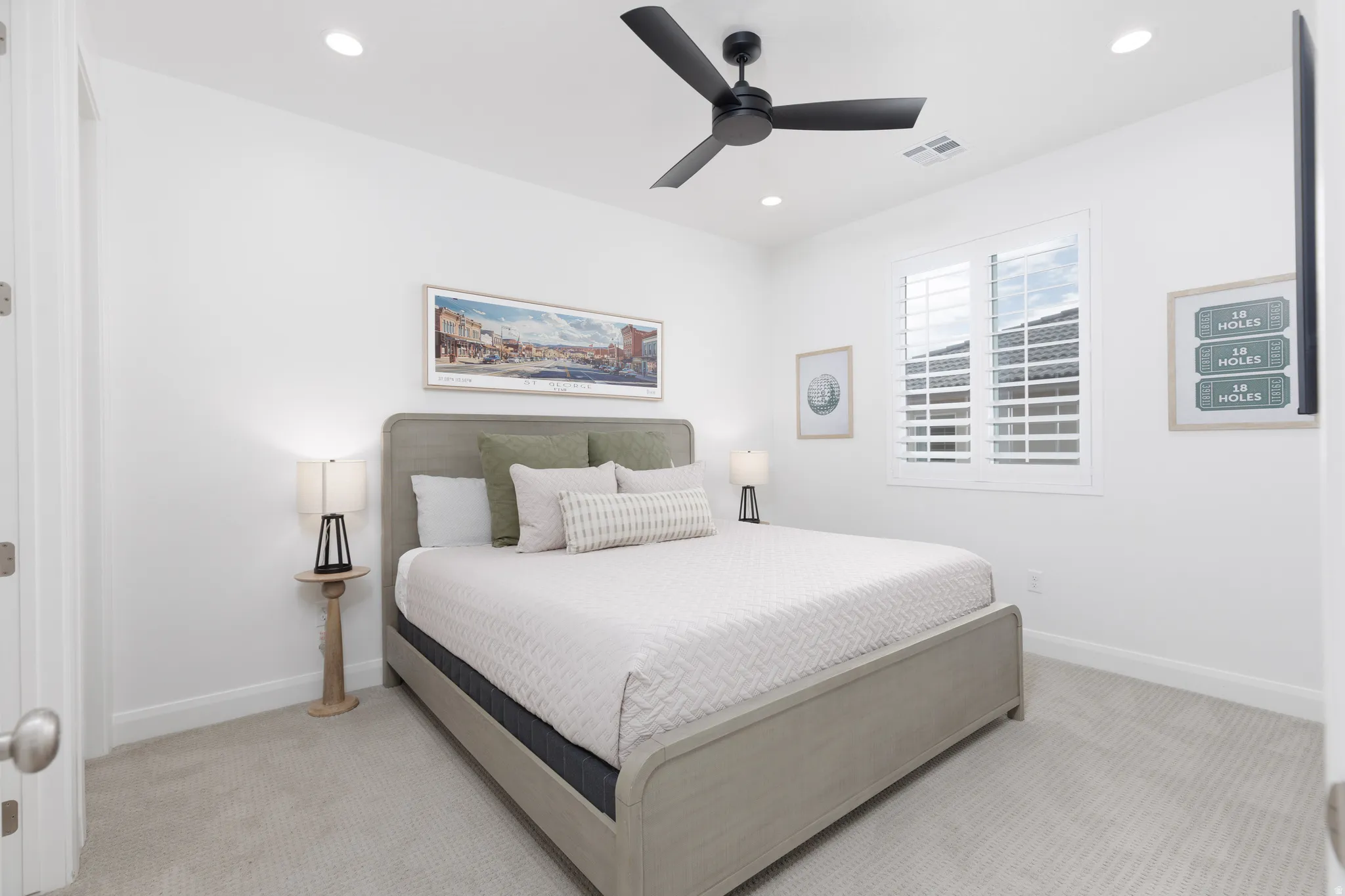 Bedroom featuring light colored carpet, a ceiling fan, and recessed lighting