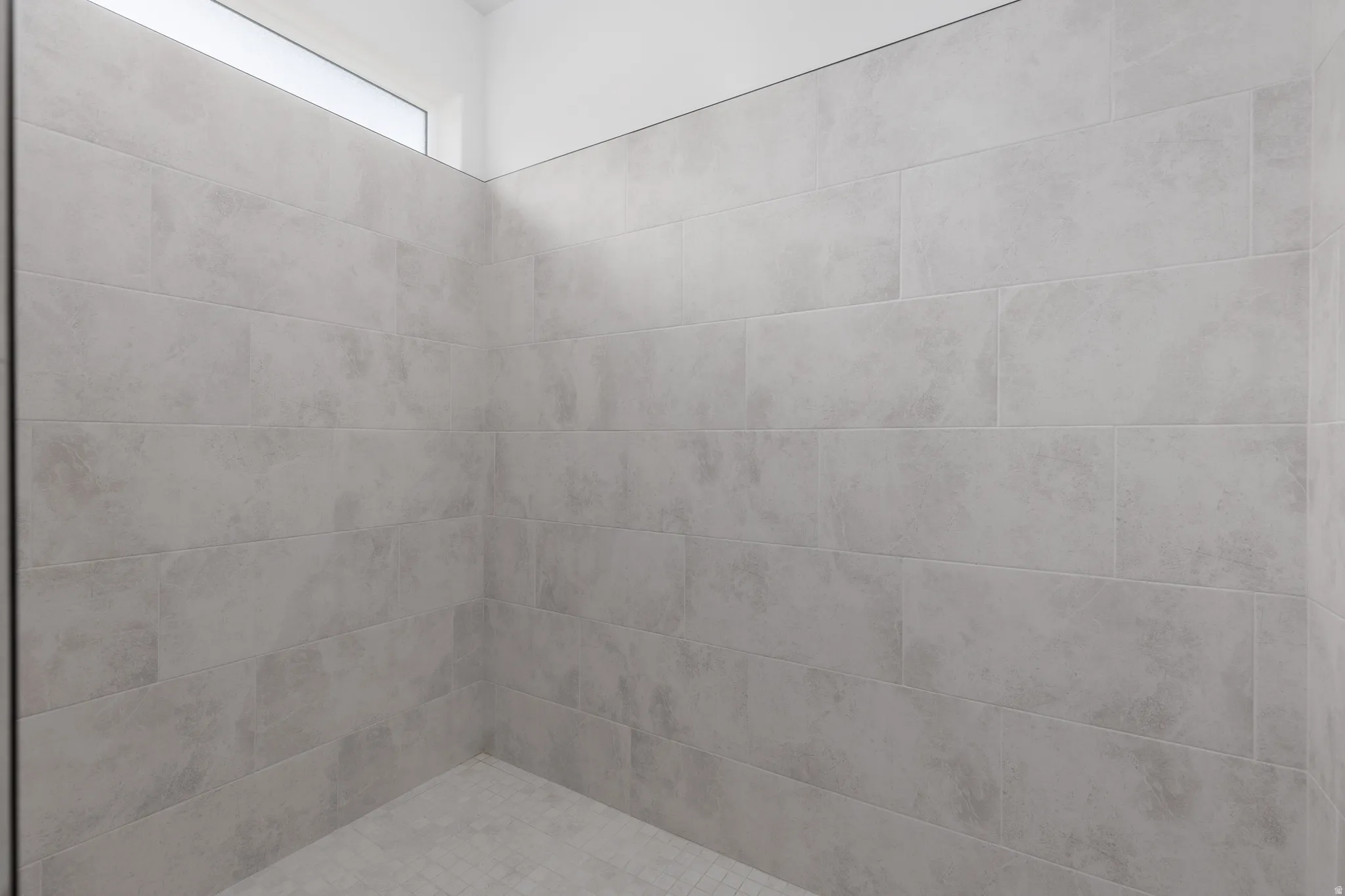 Full bathroom with tiled shower