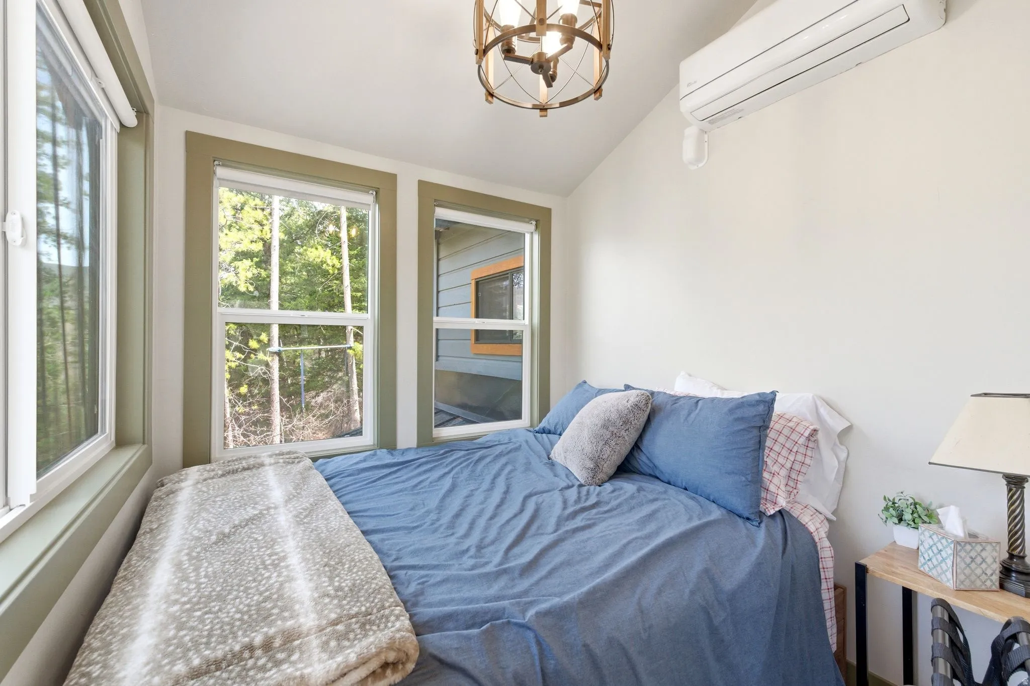 Main level bedroom with a wall mounted mini split