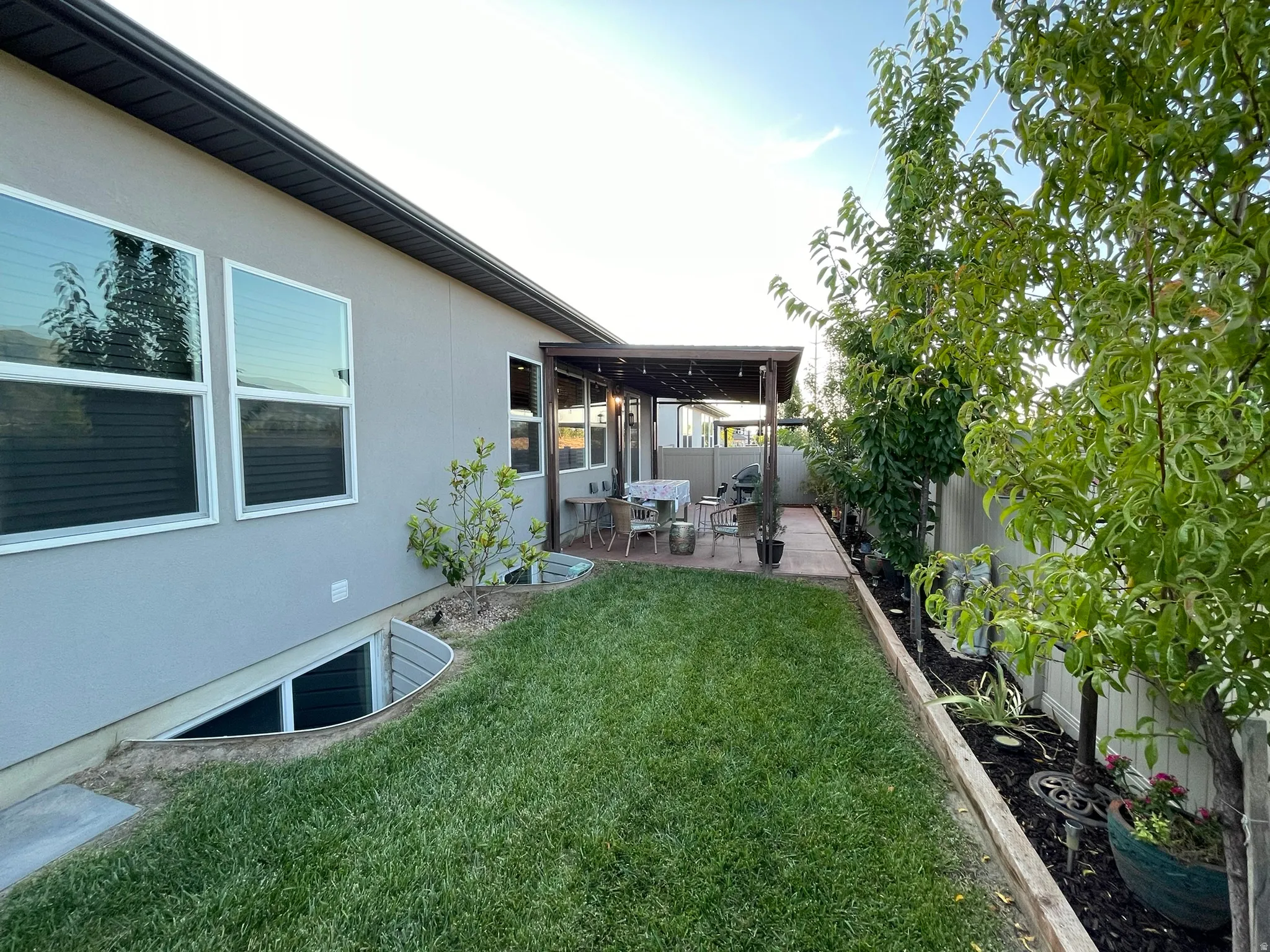 Fenced backyard featuring a patio area