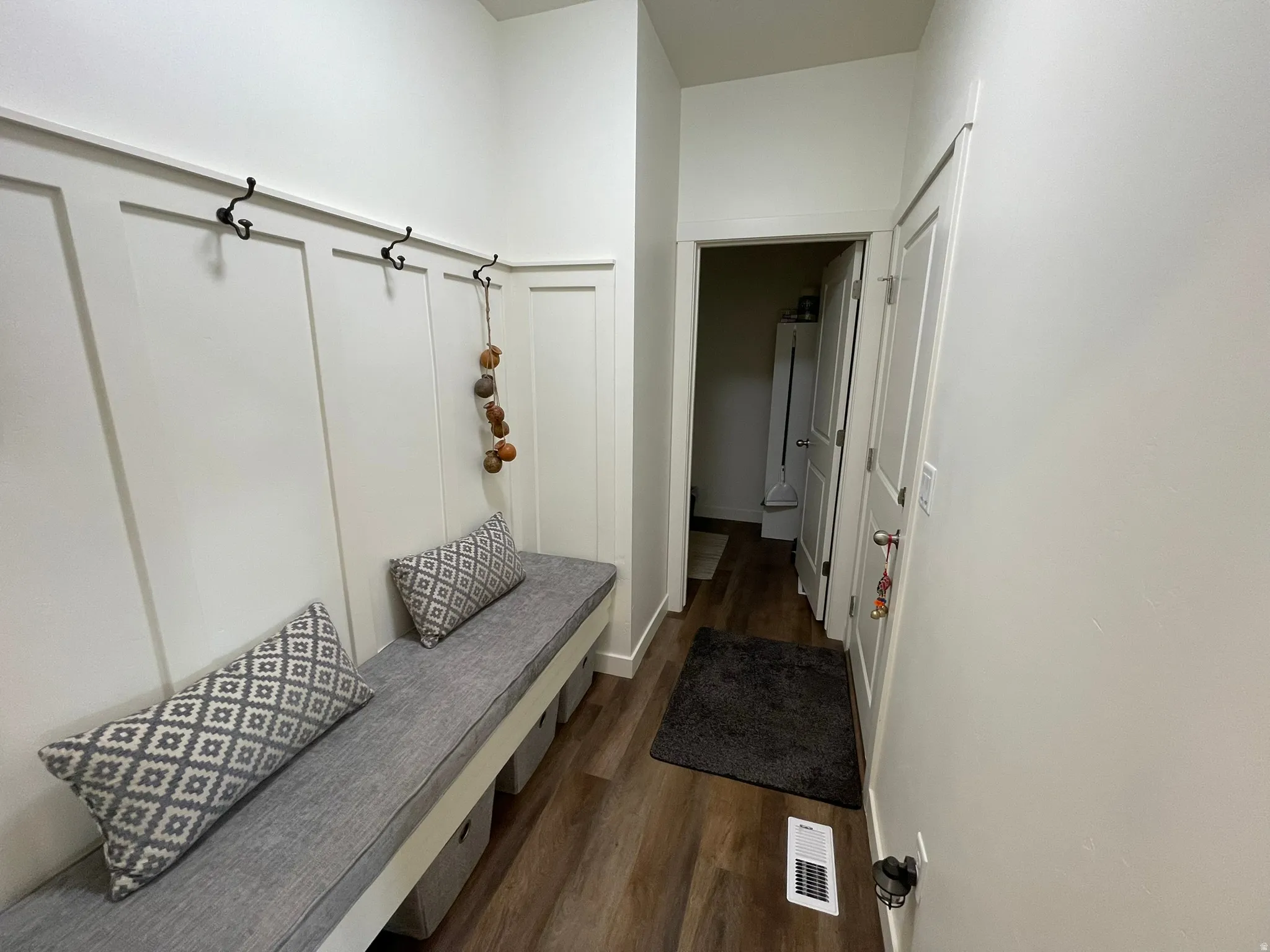 Mudroom featuring dark wood finished floors