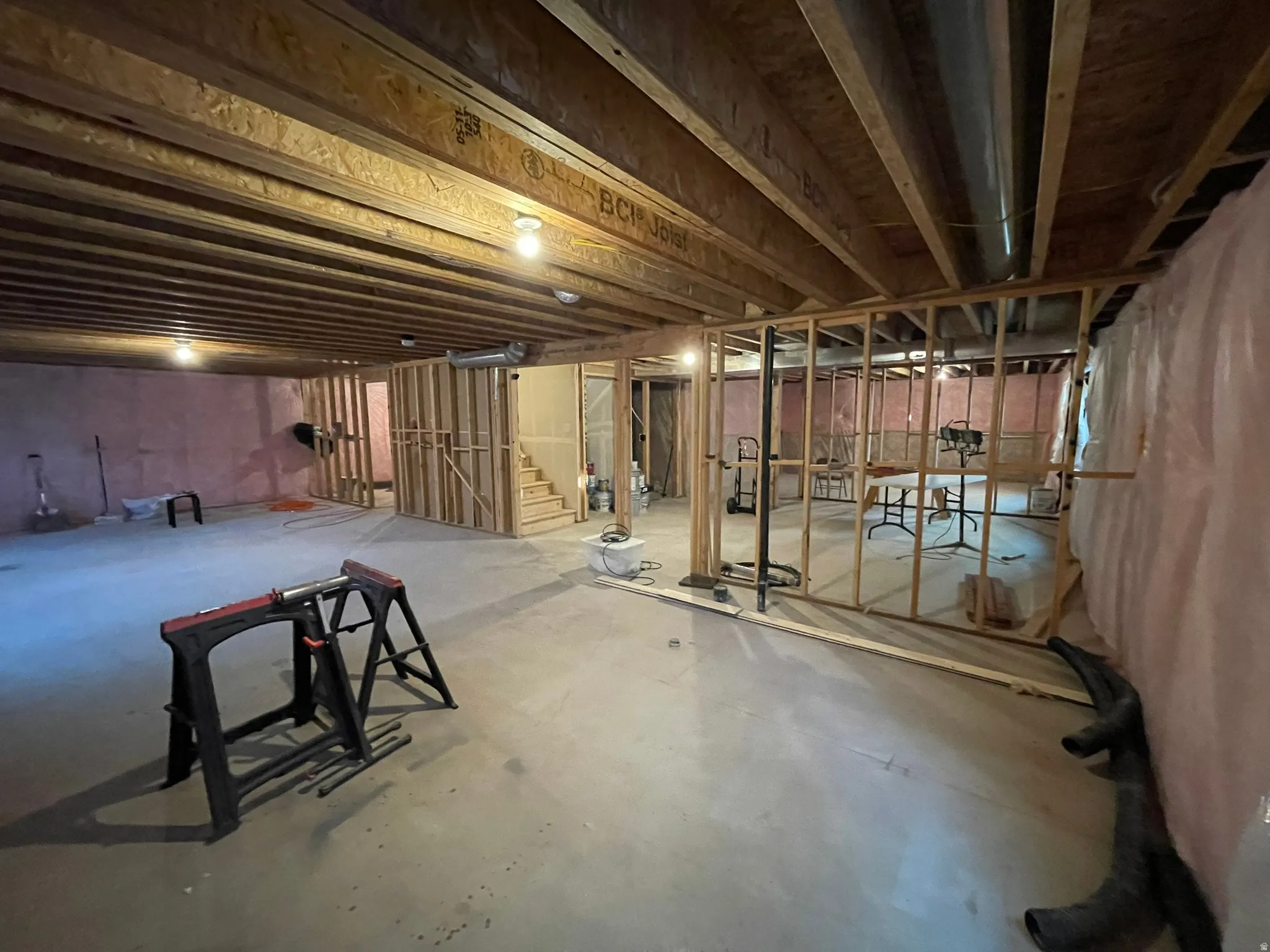 Unfinished basement featuring stairs