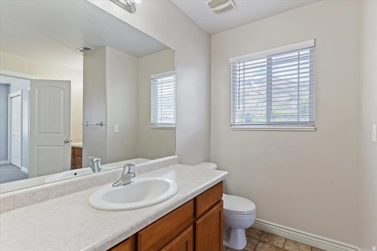 Half bath with vanity and toilet