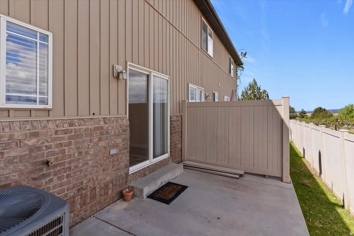 Entrance to property with a patio and board and batten siding