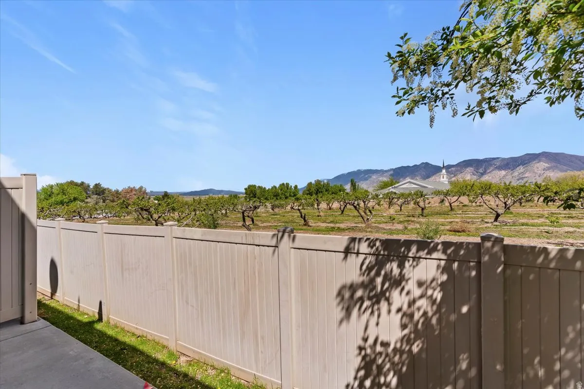 View of patio with a view of countryside and a mountain view