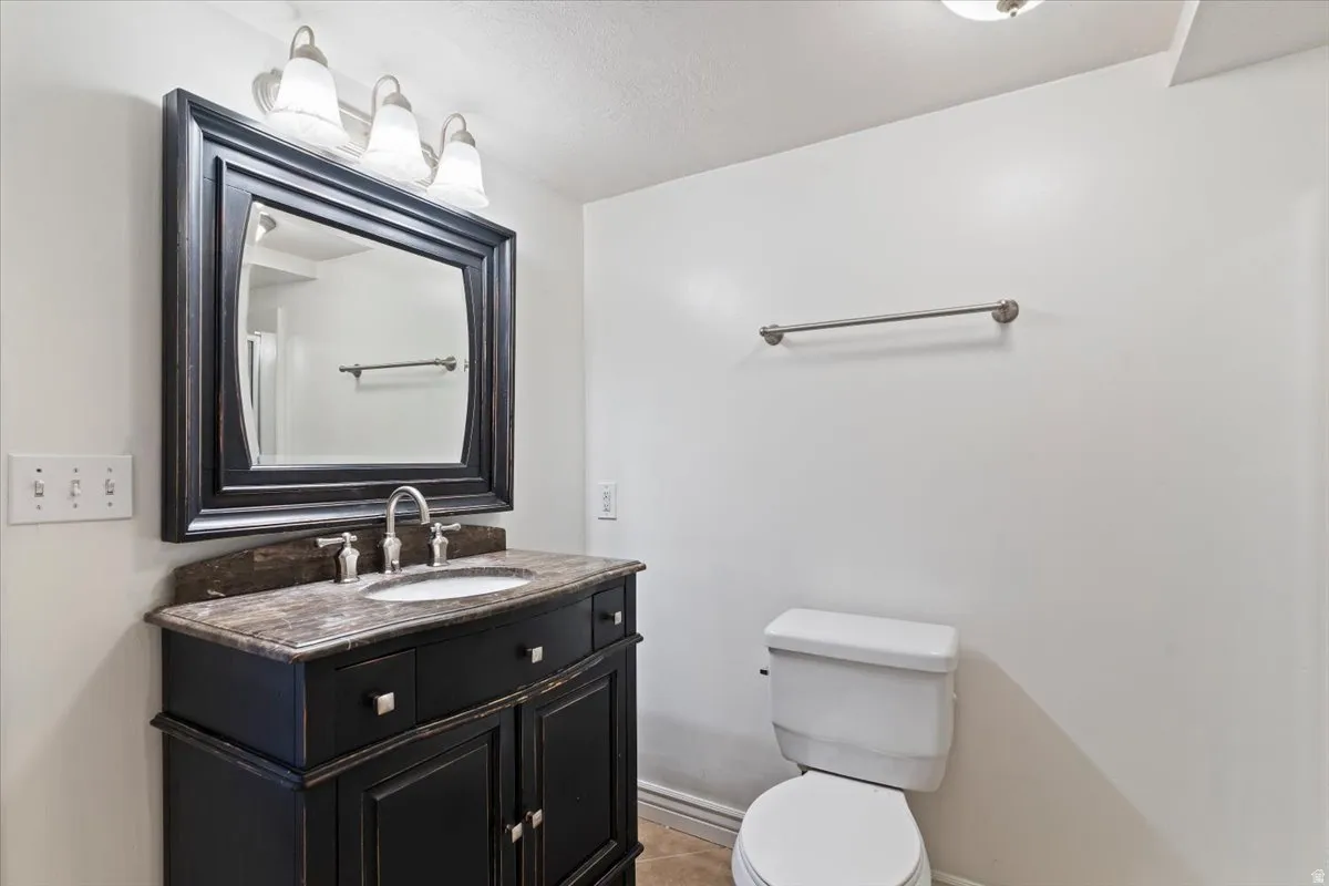 Bathroom featuring vanity and light tile patterned floors