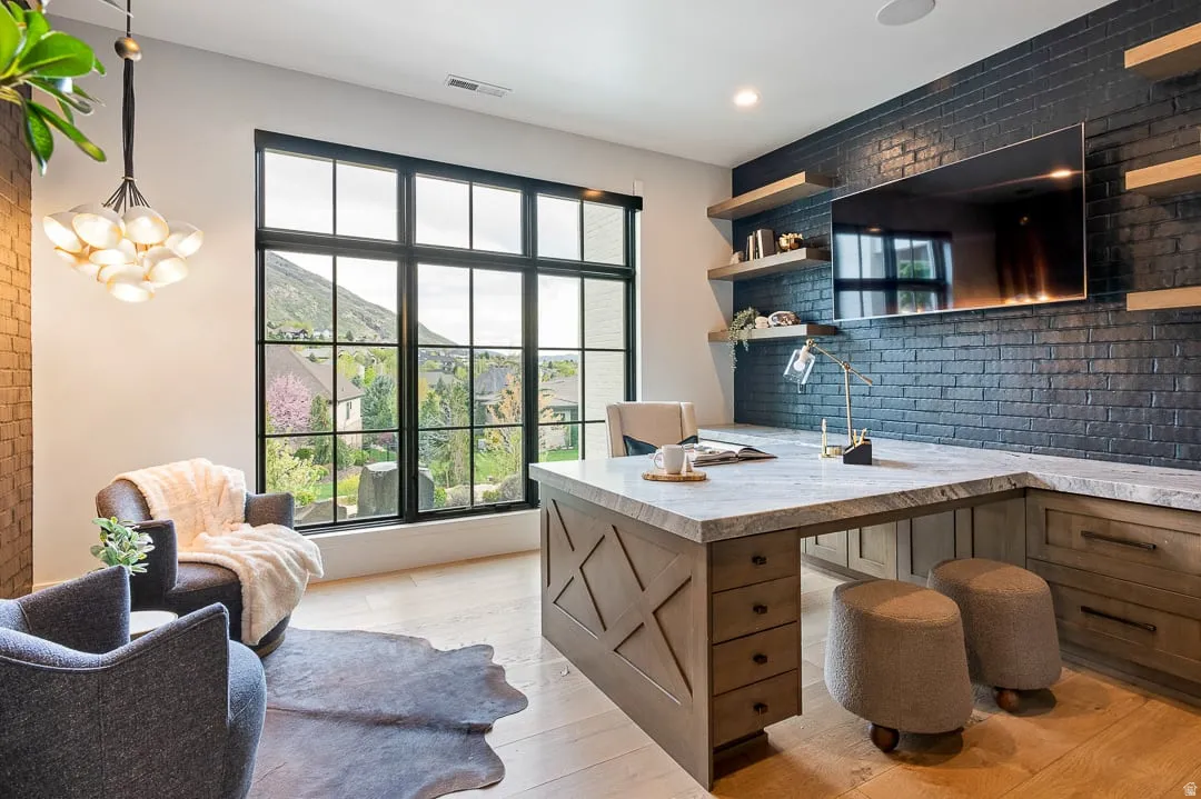 Office area with light wood-style floors