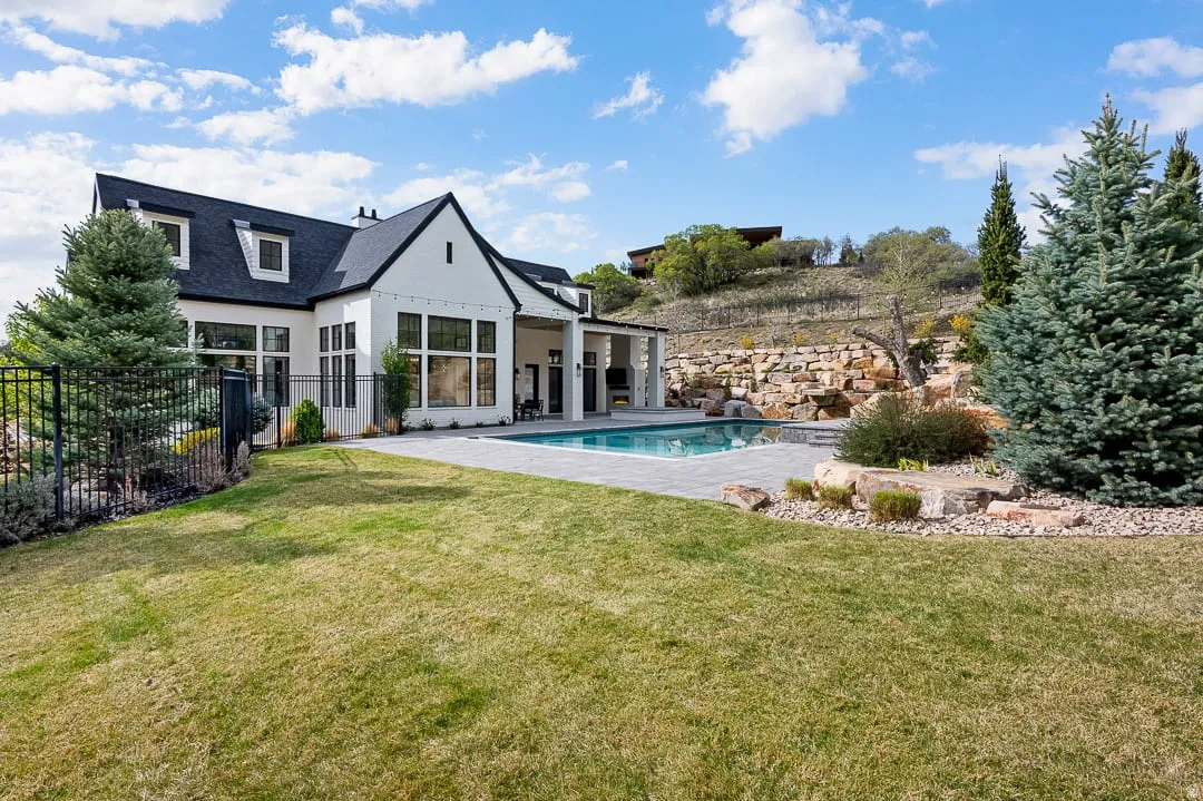 Rear view of property with a patio and stucco siding